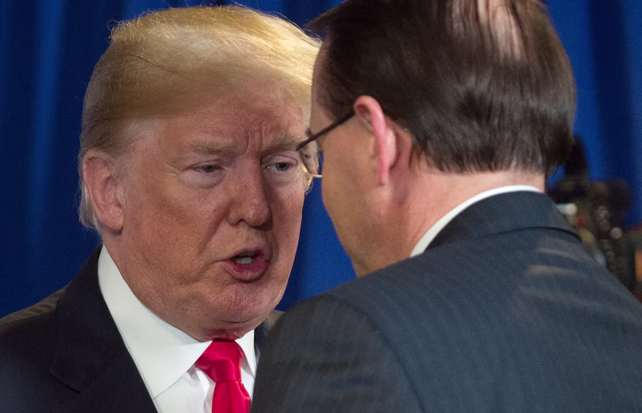 President Donald Trump speaks with Deputy Attorney General Rod Rosenstein in New York in May 2018.