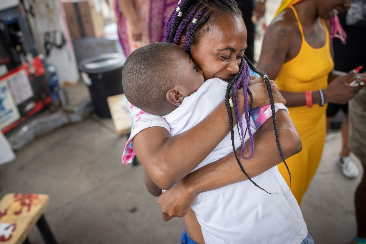 Mileesha Smith hugs Brandon Johnson at George Floyd Square after Chauvin's sentence was handed down on June 25.