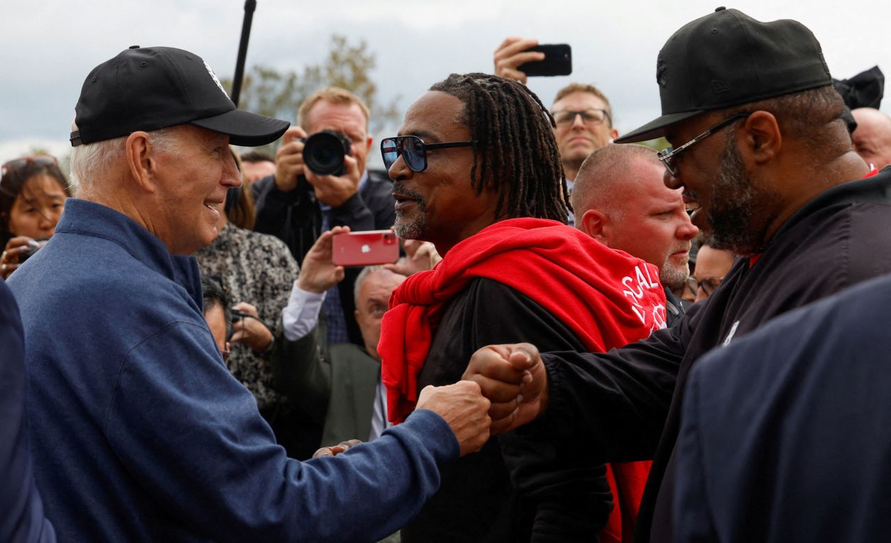 President Joe Biden greets people as he joins a UAW picket line in Belleville, Michigan, on Tuesday.