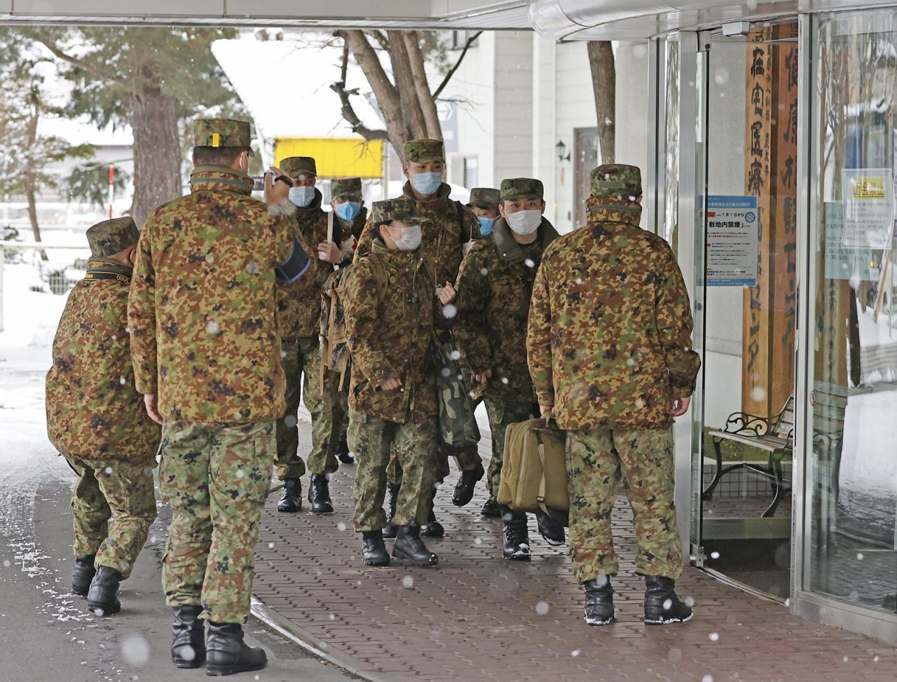 Nurses from the Japan Self-Defense Forces arrive at Yoshida Hospital in Asahikawa, Hokkaido, on Dec. 9.