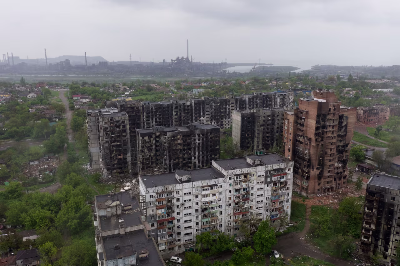 An aerial view of damaged residential buildings and the Azovstal steel plant in the background in the port city of Mariupol, on Wednesday, May 18.
