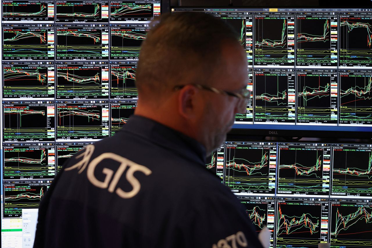 A trader works on the trading floor at The New York Stock Exchange (NYSE) following the Federal Reserve rate announcement, in New York City today.