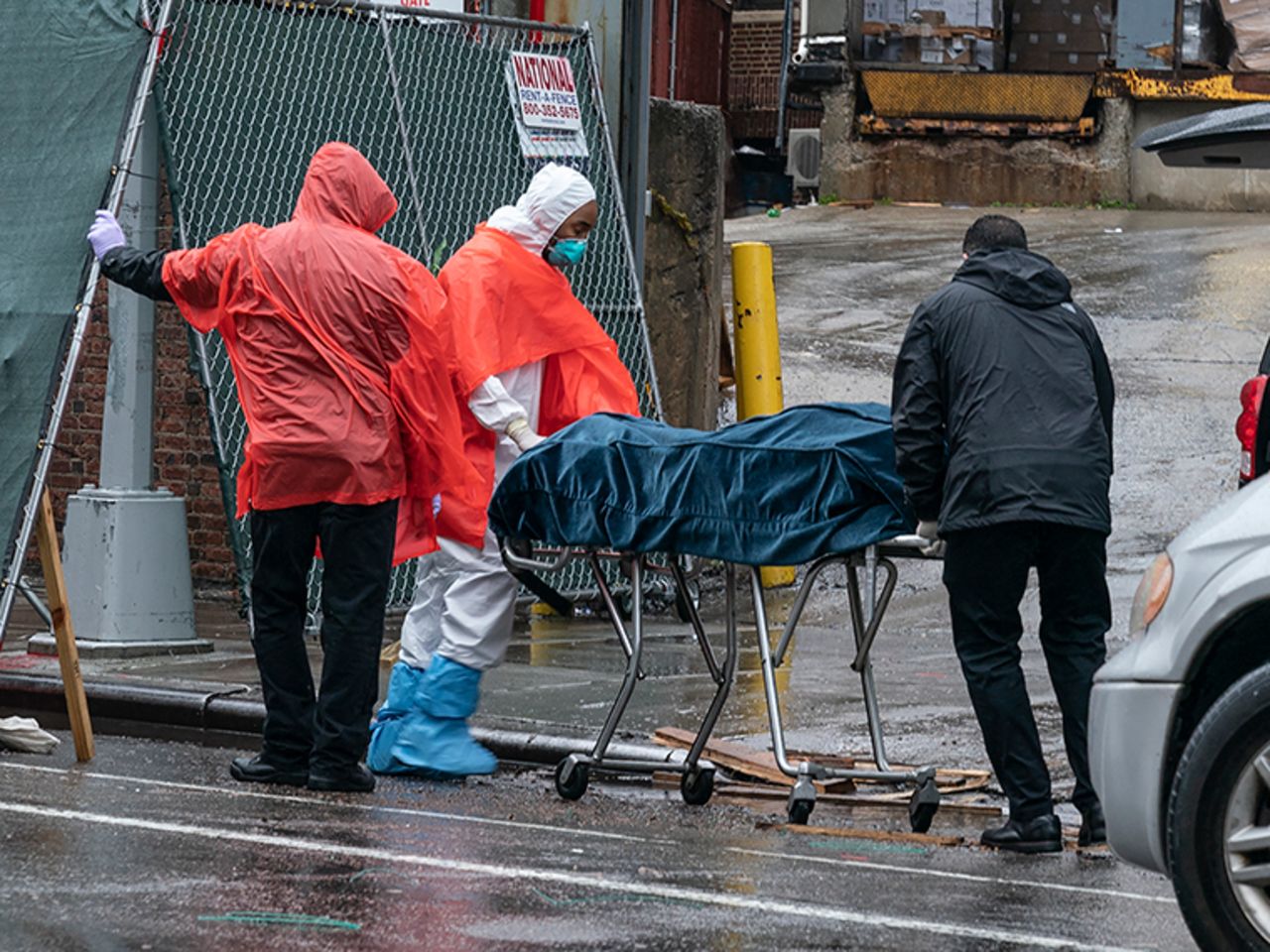 Funeral workers and hospital staff retrieve deceased bodies for burial at the Brooklyn Hospital Center on Monday, April 13, in New York.