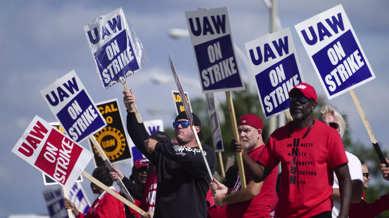 United Auto Workers members walk the picket line at the Ford Michigan Assembly Plant in Wayne, Michigan, on Monday, Sept. 18.