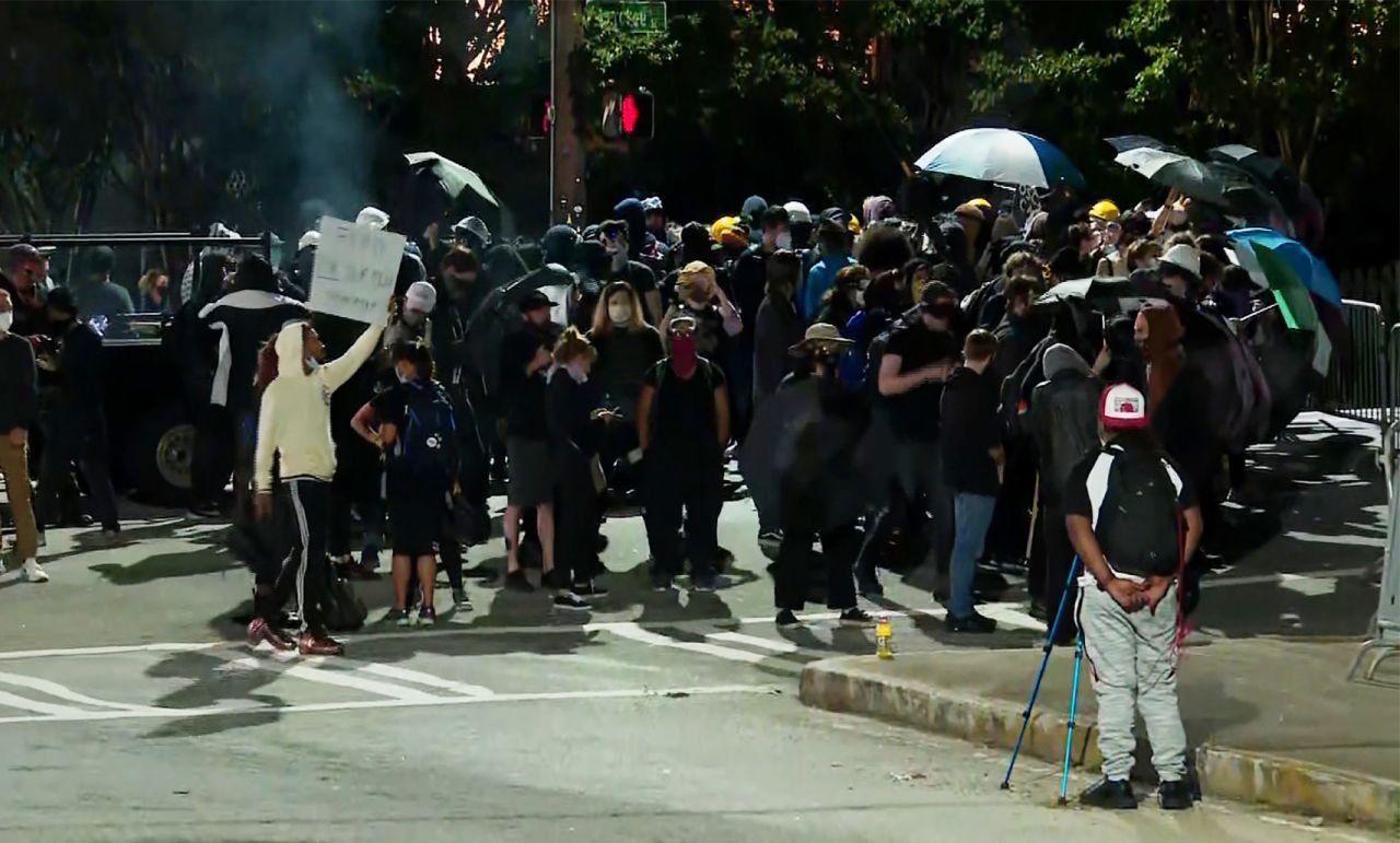 Protesters standing outside of Atlanta's Zone 3 police precinct. 