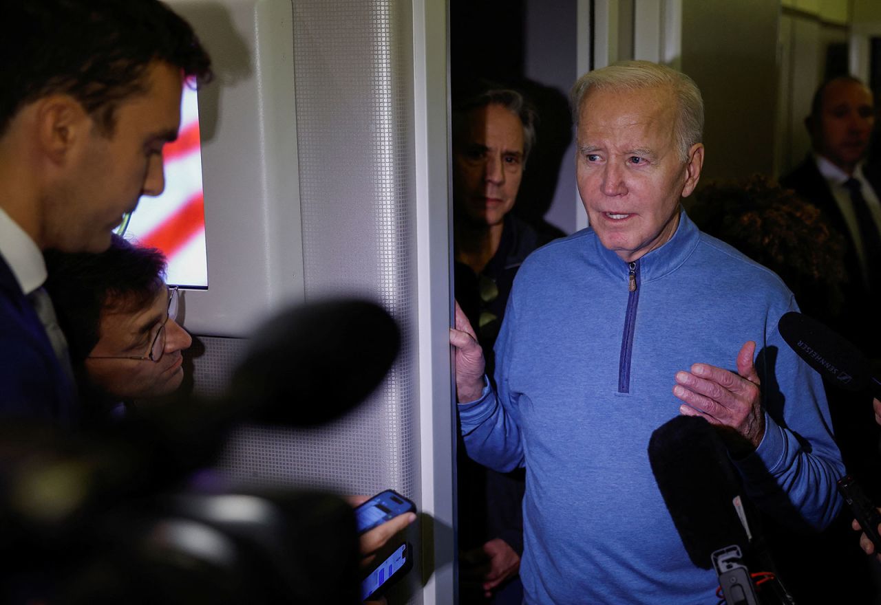 Biden speaks to re in front of the U.S. Secretary of State Antony Blinken, onboard of Air Force One en route from Israel, amid the ongoing conflict between Israel and Hamas, at Ramstein Air Base, Germany, October 18, 2023. REUTERS/Evelyn Hockstein