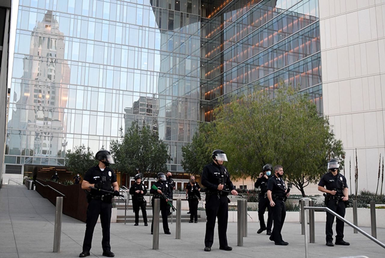  LAPD officers stand guard outside the Police Headquarters  in Los Angeles on Thursday, May 28.