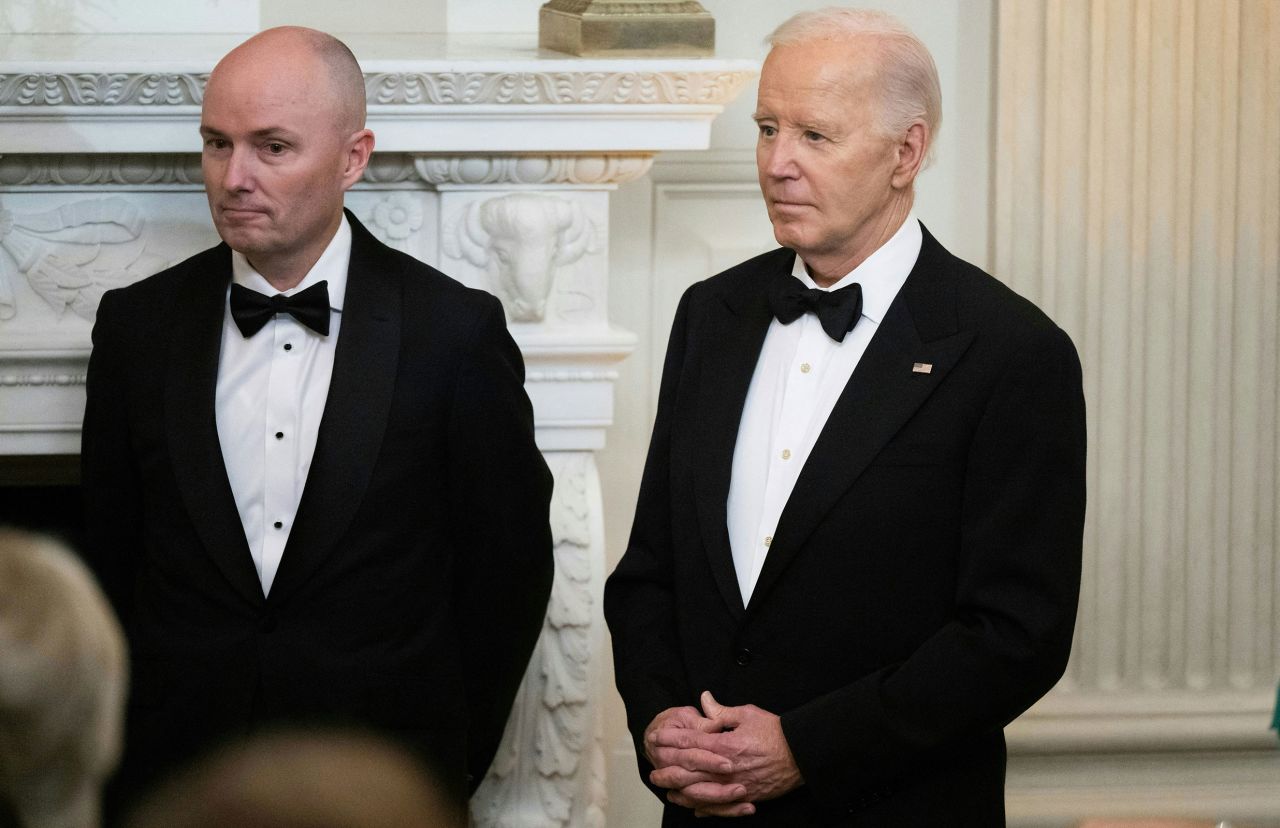 President Joe Biden stands alongside Utah Governor Governor Spencer Cox, left, during a black-tie dinner following the National Governors Association meetings in the State Dining Room of the White House in Washington, DC, on February 24. 