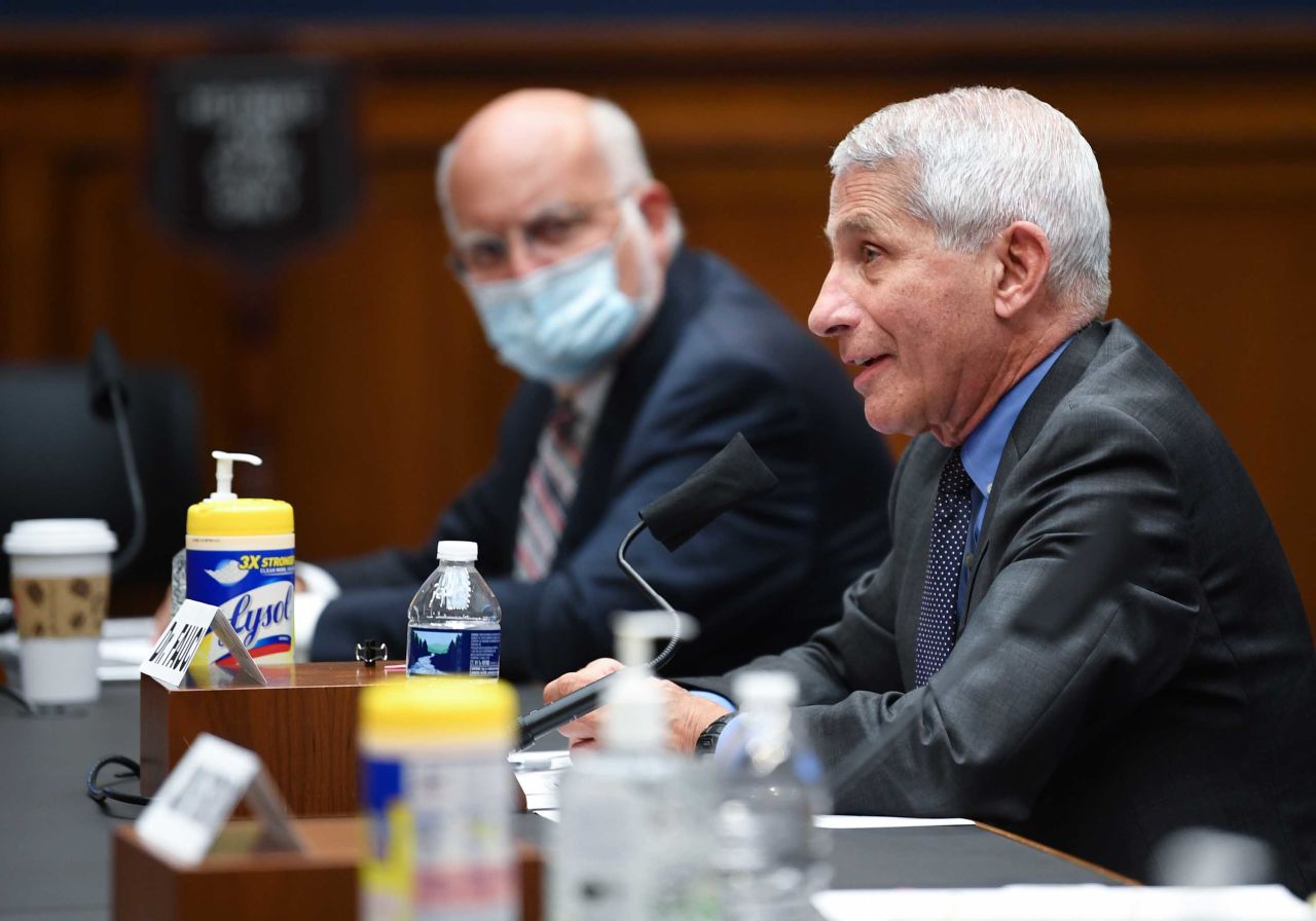 Dr. Robert Redfield, left, listens as Dr. Anthony Fauci testifies before the US Senate Health, Education, Labor, and Pensions Committee hearing to examine Covid-19 on Capitol Hill in Washington on June 23.