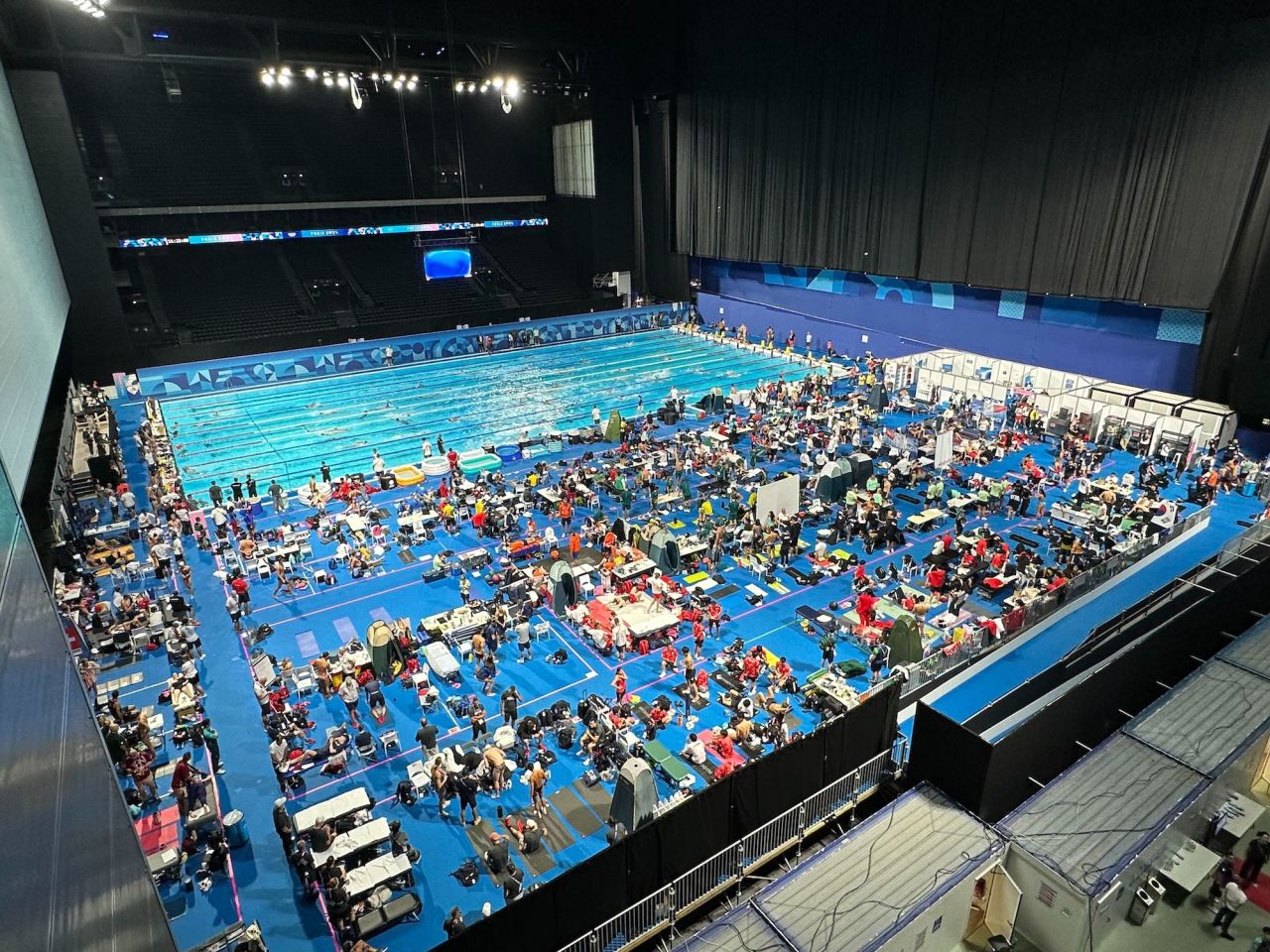 La Défense Arena is seen on Tuesday. Behind the scenes and a big black curtain lies a warm-up pool area where Olympic competitors can practice techniques, get treatment or stretch.