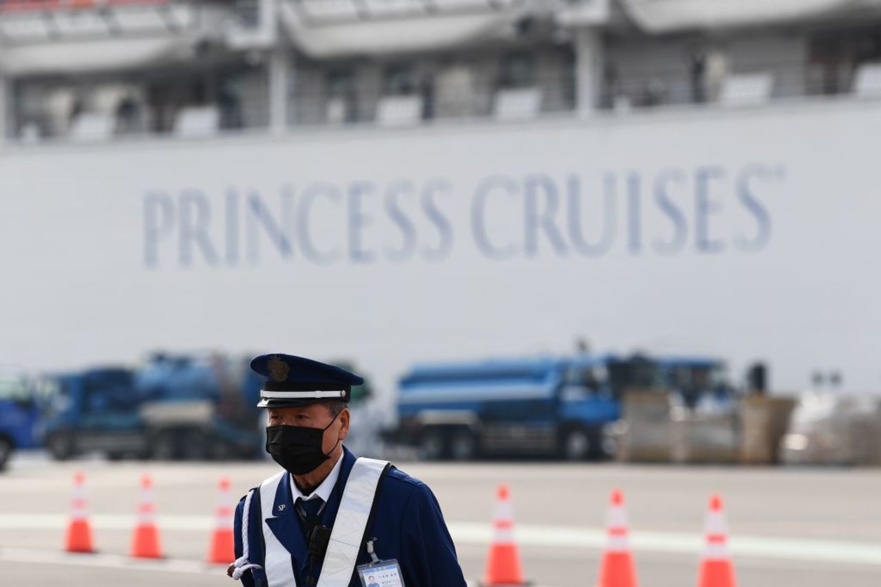 Passengers are seen on balconies of the Diamond Princess cruise ship, with thousands of people quarantined onboard due to fears of the new coronavirus, at the Daikoku Pier Cruise Terminal in Yokohama port on February 14.