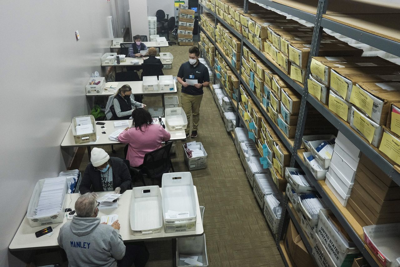 Election workers open and count ballots to be processed at the Franklin County Board of Elections on November 3, in Columbus, Ohio. 