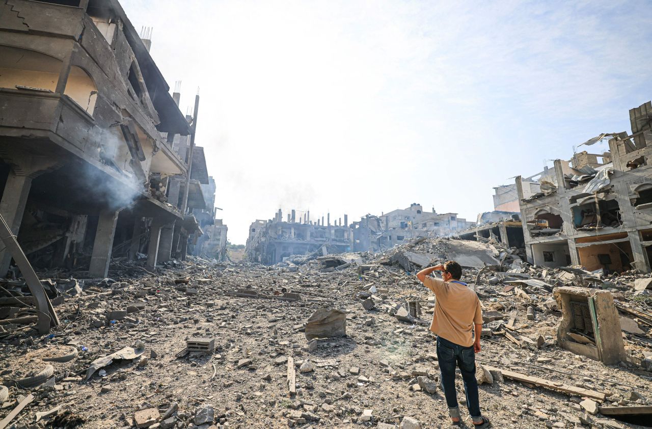 A man looks at destruction from Israeli airstrikes in Gaza, on October 11, 2023.?