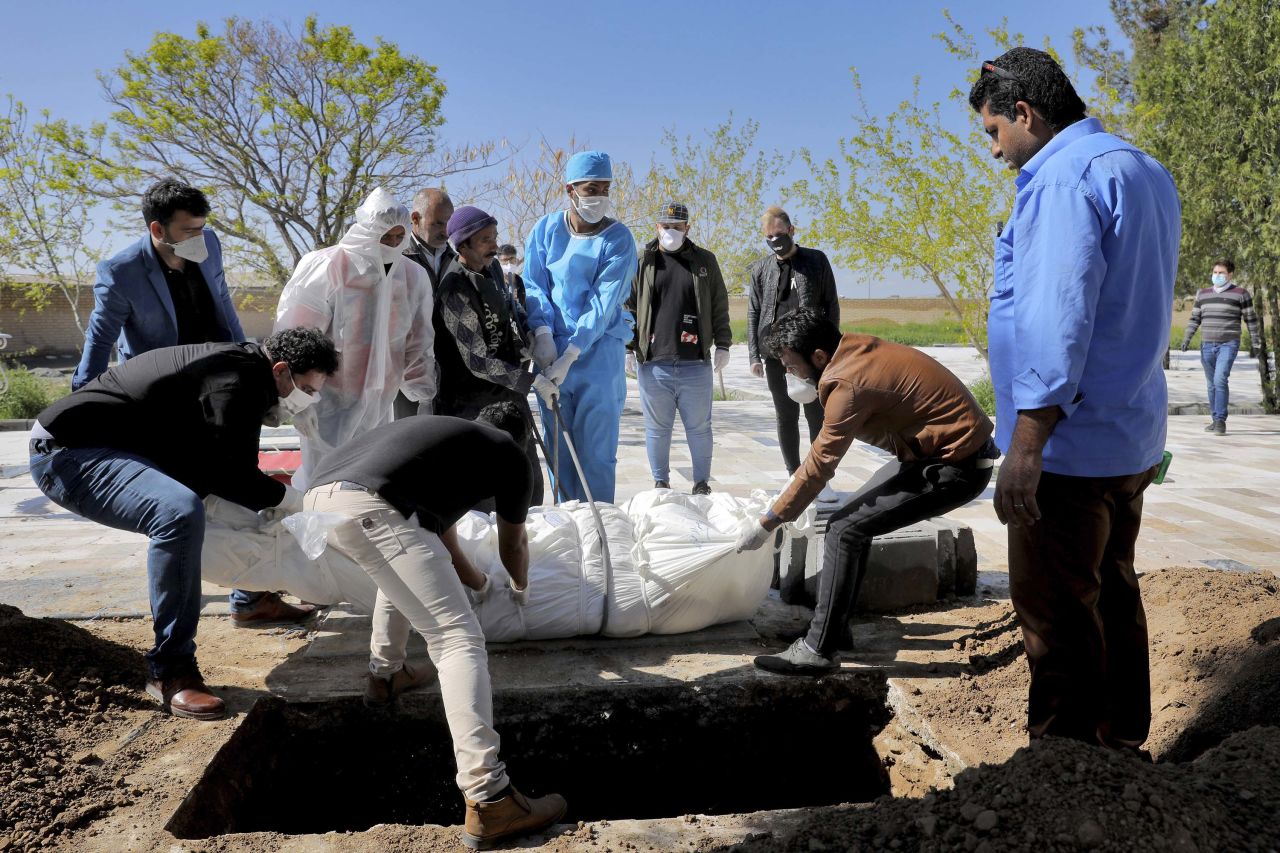 Mourners attend the funeral of a victim who died after being infected with coronavirus, at a cemetery outside Tehran, Iran, on March 30.