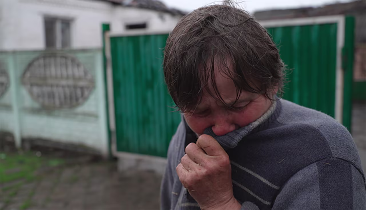 Two shells went straight through Galina Nikolaevna’s roof, destroying her home. Still, she worries about leaving her property.