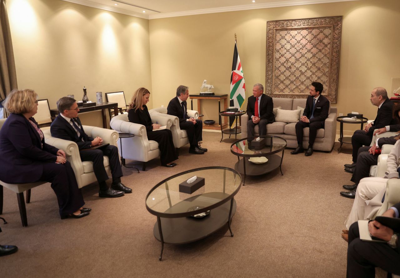 Jordan's King Abdullah II and Crown Prince Hussein, fifth and sixth from left, meet with US Secretary of State Antony Blinken, fourth from left, and officials in Amman, Jordan, in this handout photo released on January 7.