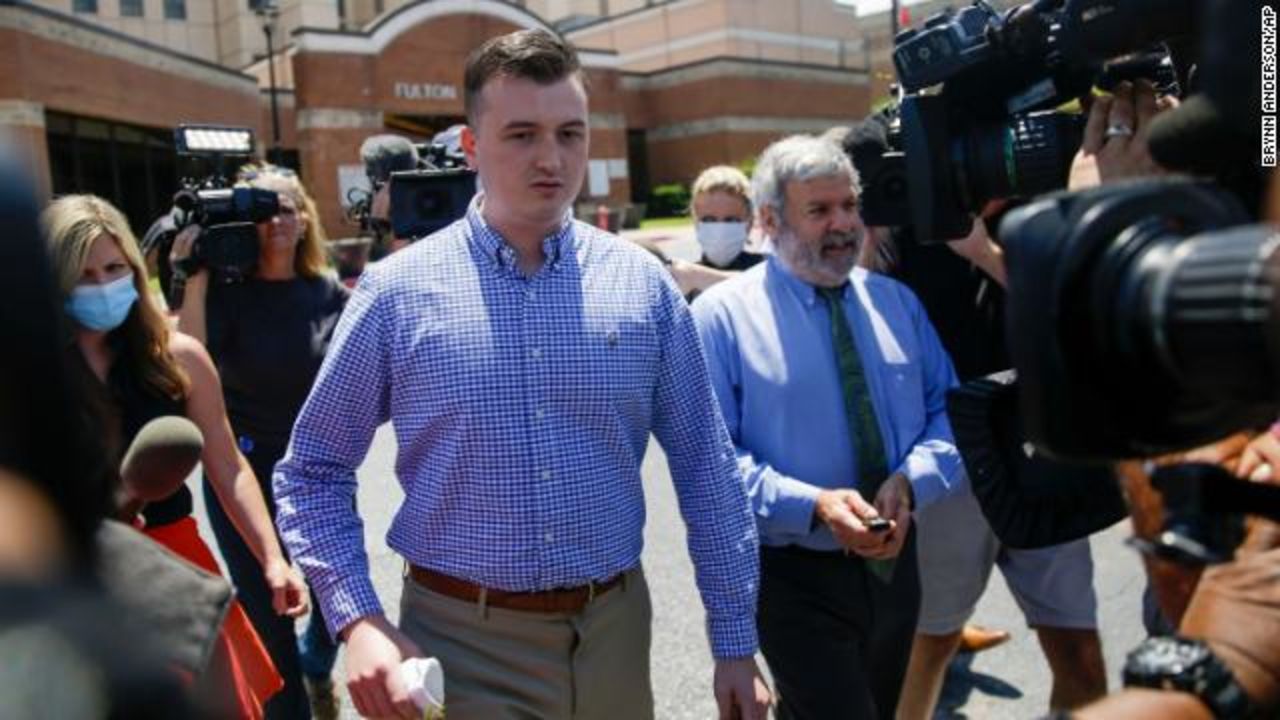 Former Atlanta Police officer Devin Brosnan is surrounded by media following his release from the Fulton County Jail on Thursday, June 18, in Atlanta.