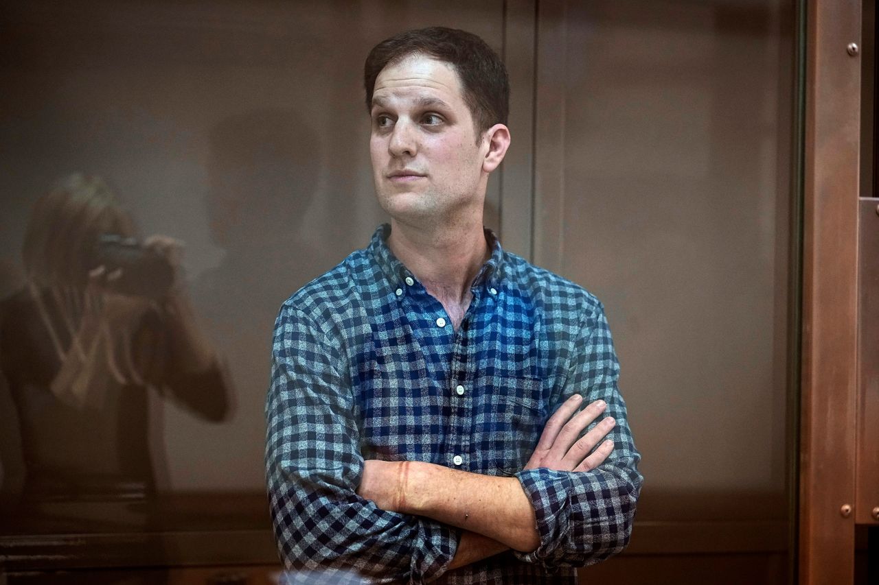 Wall Street Journal reporter Evan Gershkovich stands in a glass cage in a courtroom in Moscow on April 18. 