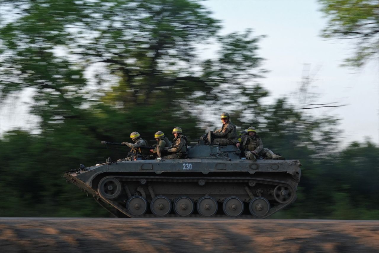 Ukrainian soldiers ride on a BMP infantry fighting vehicle toward Bakhmut on Saturday.