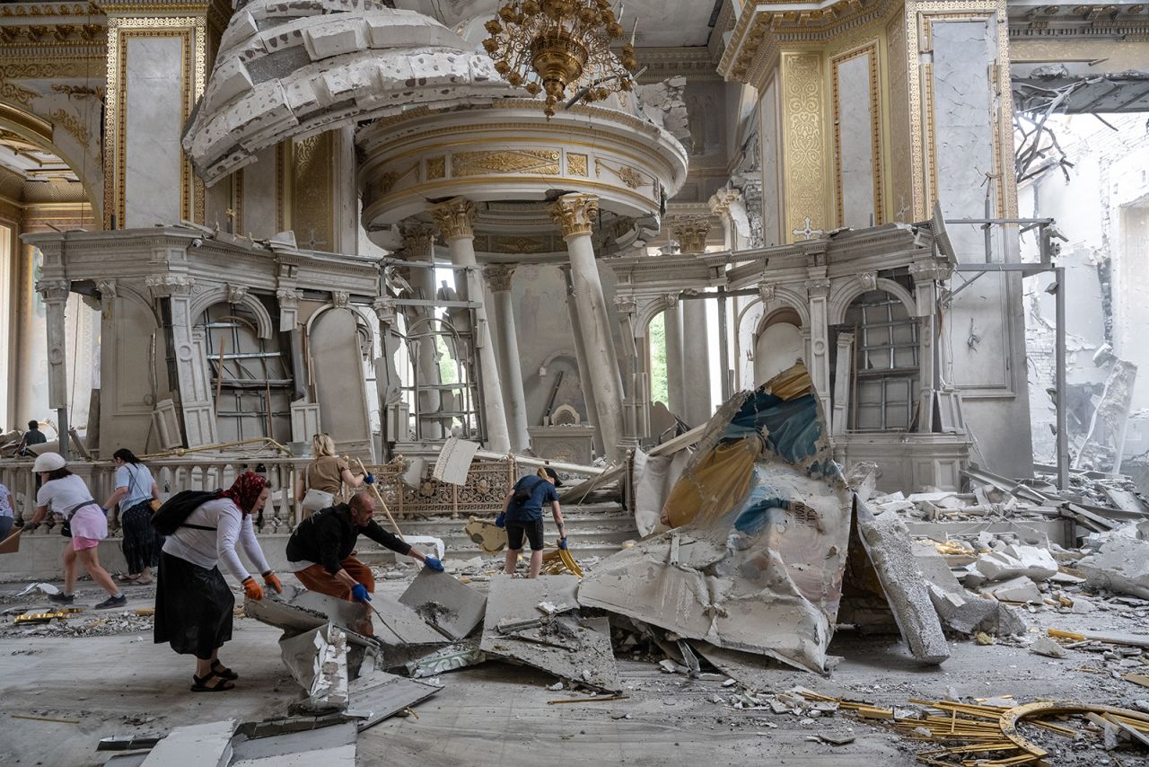 People clear away debris after a Russian missile struck the historic Holy Transfiguration Cathedral in central Odesa, Ukraine, on July 23.