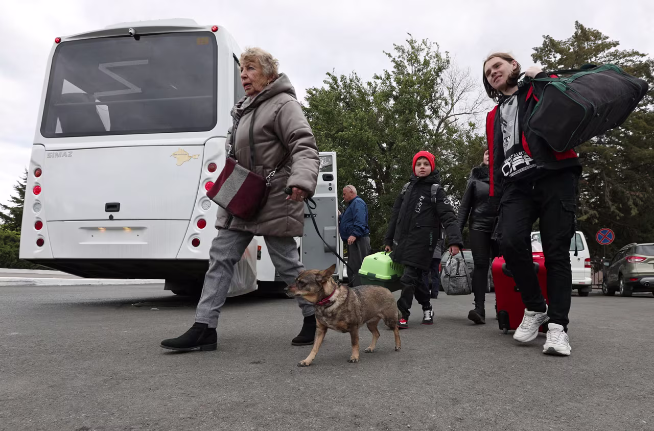 Civilians evacuated from Kherson, Ukraine arrive at a railway station in Dzhankoi, Crimea, on October 20. 