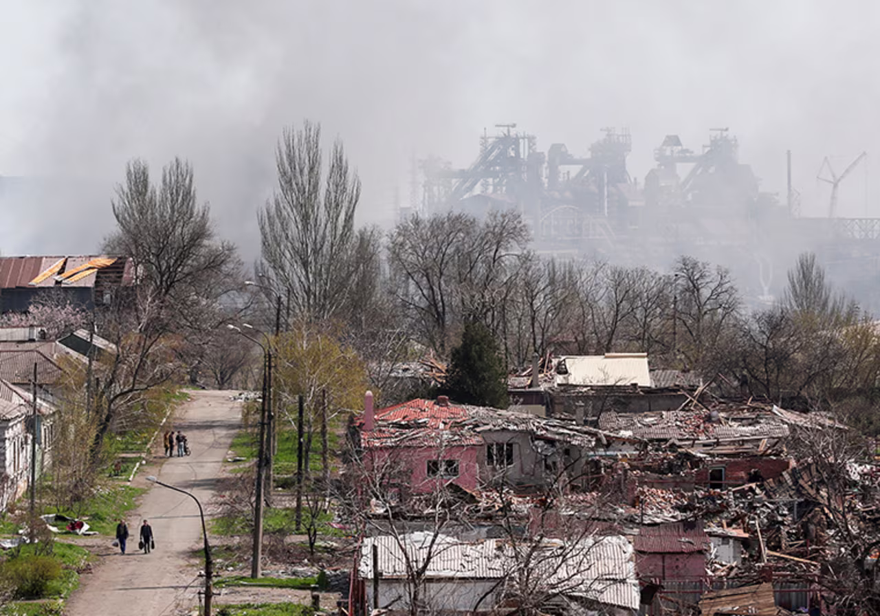 Smoke rises above the Azovstal Iron and Steel Works company and buildings in Mariupol, Ukraine, on Monday, April 18,