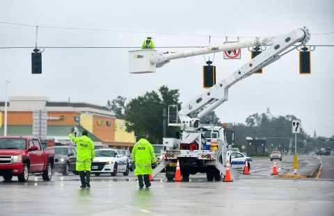 Police officers direct the traffic during a power outage after Hurricane Ian passed through Bartow, Florida on September 29.