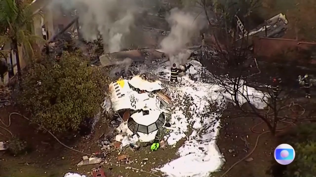 Emergency responders work the scene of a plane crash in Vinhedo, Brazil, on Friday.