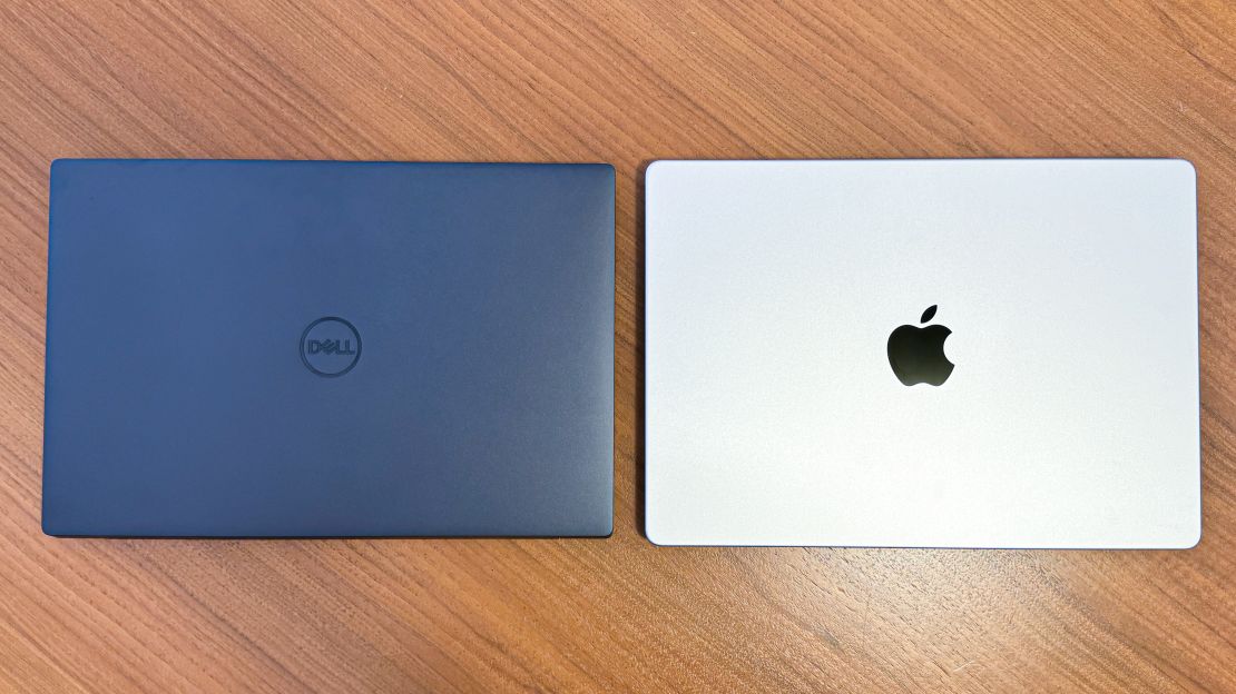 (l, R) dell xps 14 and apple macbook pro 14 both closed shut on a table