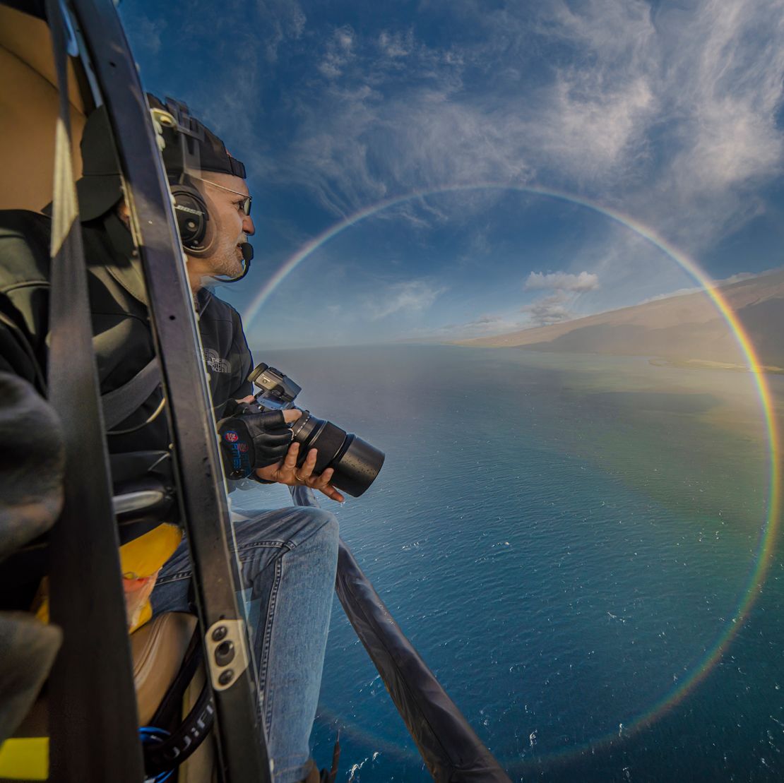 On a trip flying 3,200 feet over Molokai, Hawaii, Delson was captured inside a rare double circular rainbow.