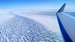 This photograph shows ripples in the surface of Denman Glacier in East Antarctica that throw shadows against the ice. The glacier is melting at a faster rate now than it was from 2003 to 2008.