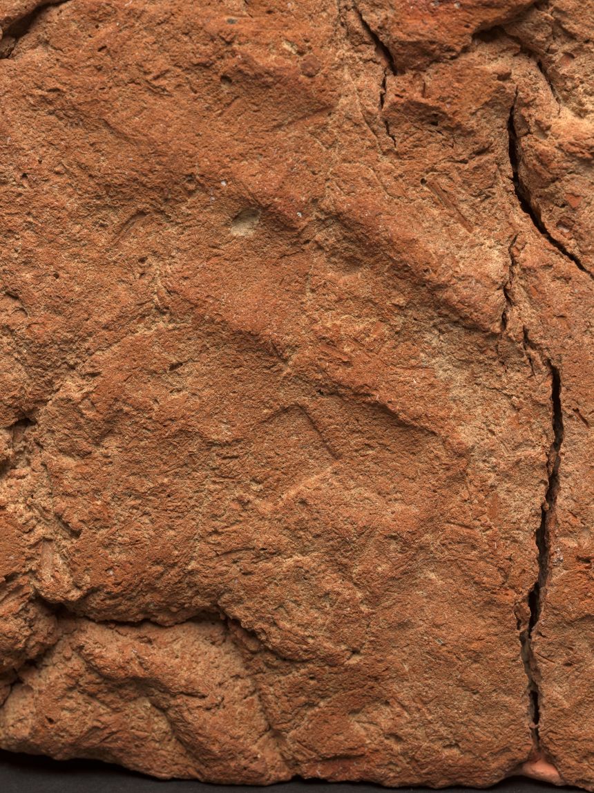 The handprint is likely to have been from the potter who made the soul house.