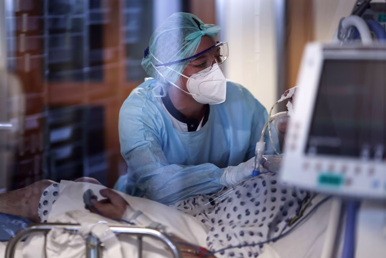 A medical worker tends to a patient in the Covid-19 intensive care unit at The University Hospital Centre in Liege, Belgium, on October 22.