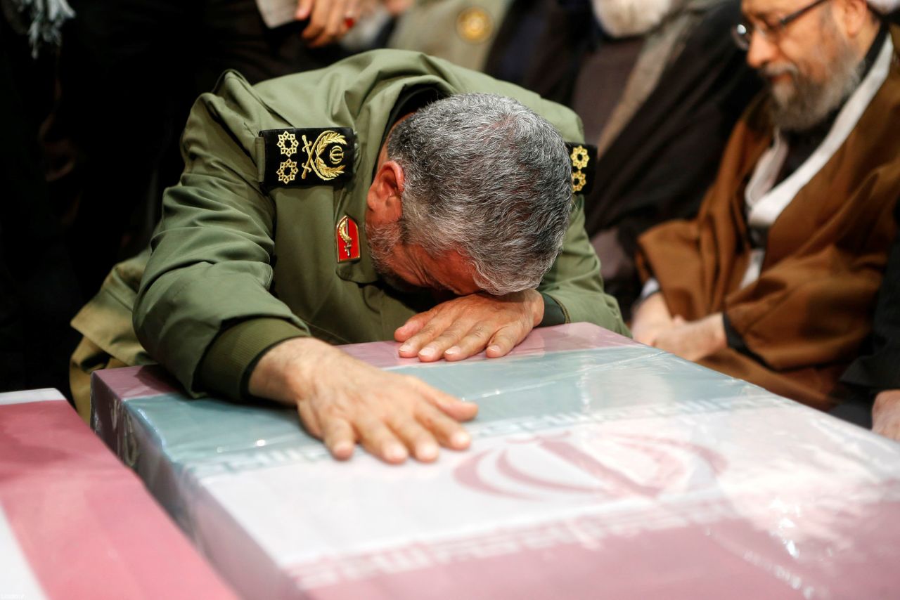 General Ismail Qaani -- Soleimani's long-time lieutenant and his successor as the leader of Iran's Islamic Revolutionary Guards' Quds Force -- cries over Soleimani's coffin during the funeral ceremony on Monday. 