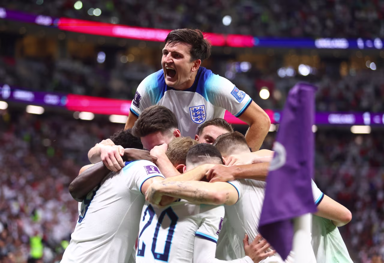 England celebrates Harry Kane scoring their second goal at Al Bayt Stadium in Al Khor, Qatar on Sunday.