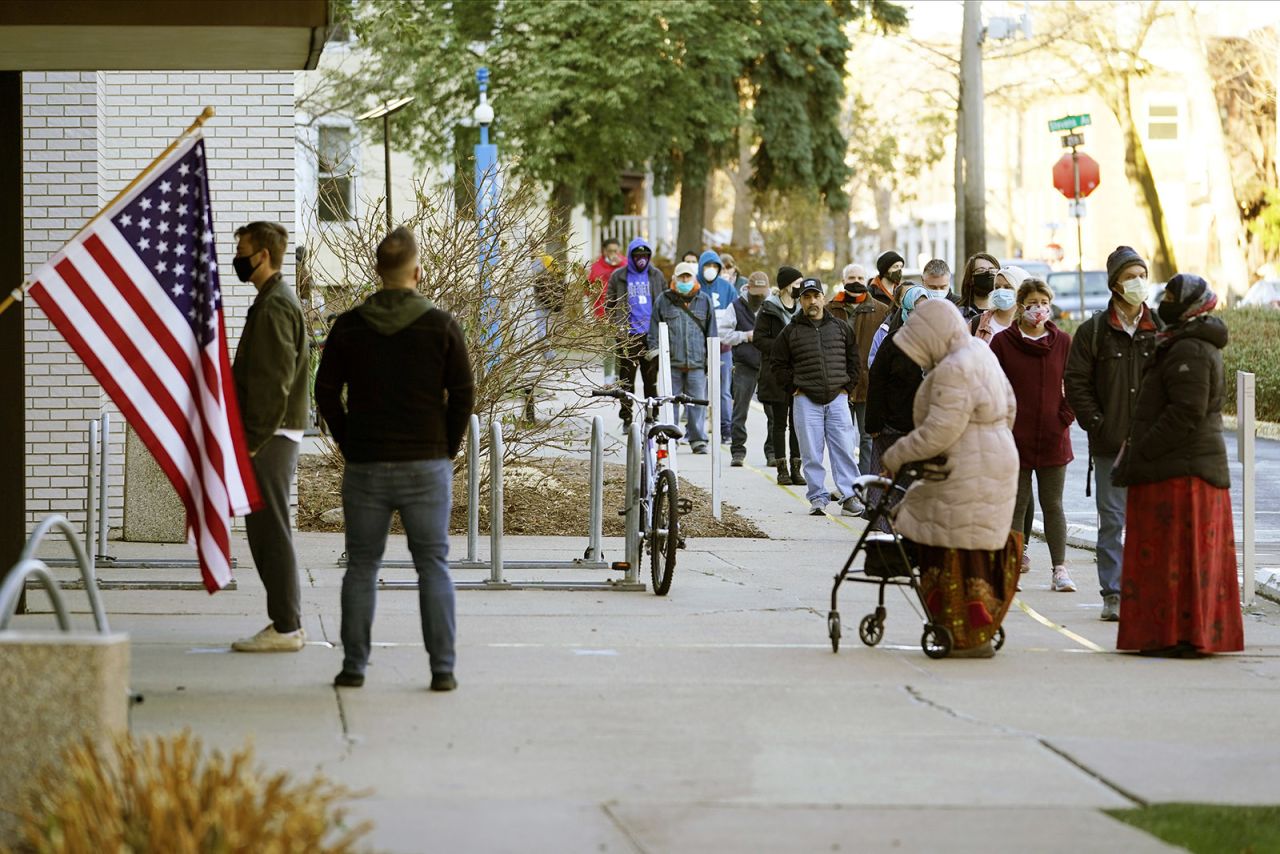 Voters wait to cast their votes on Election Day, Tuesday, Nov. 3, at the Minneapolis College of Art and Design in Minneapolis.