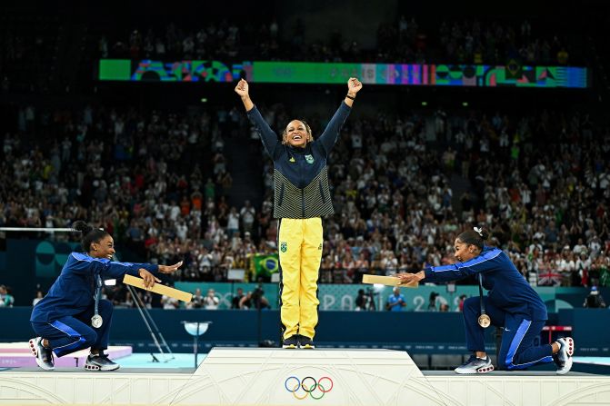 American gymnasts Simone Biles, left, and Jordan Chiles <a >bow to Brazil's Rebeca Andrade</a> after she won Olympic gold in the floor exercise on August 5. It was <a >the first all-Black Olympics gymnastics podium</a>. However, on August 11, the International Olympic Committee announced that <a >Chiles' bronze medal would be reallocated to Romanian gymnast Ana B?rbosu</a> after the Court of Arbitration for Sport ruled that an appeal made by the United States over Chiles' score was filed too late.