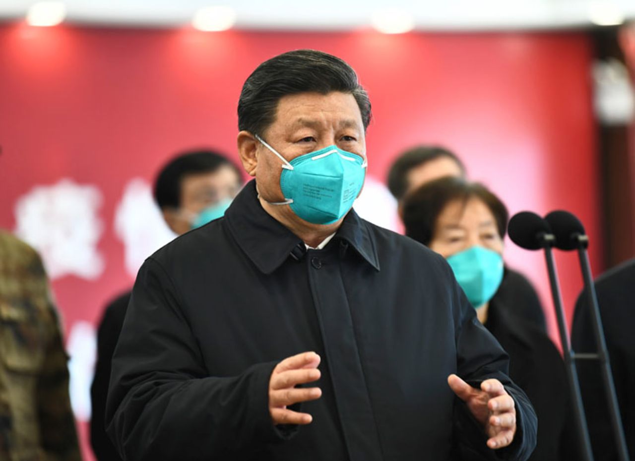 In this photo released by China's Xinhua news agency, Chinese President Xi Jinping talks by video with patients and medical workers at the Huoshenshan Hospital in Wuhan in central China's Hubei Province, Tuesday, March 10.