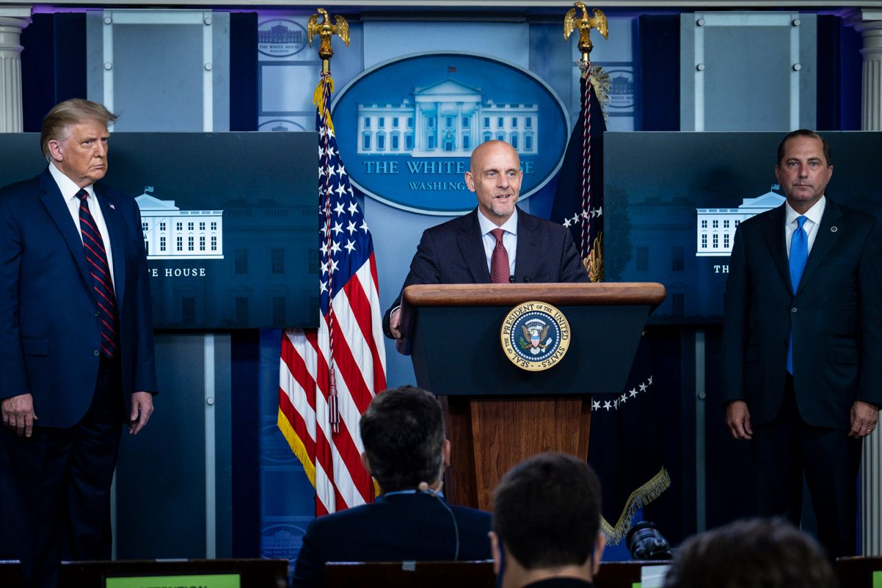 US President Donald Trump and Health and Human Services Secretary, Alex Azar look on as FDA Commissioner Stephen Hahn addresses the media during a press conference in James S. Brady Briefing Room at the White House on on August 23, in Washington, DC.