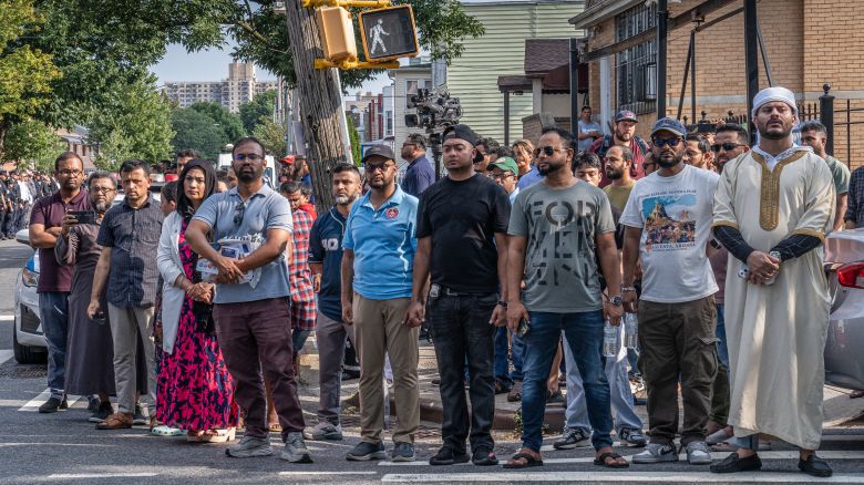 A large showing of New York City police officers and community members lined the streets outside  the Jame Masjid mosque in the Bronx to honor slain officer Didarul Islam.