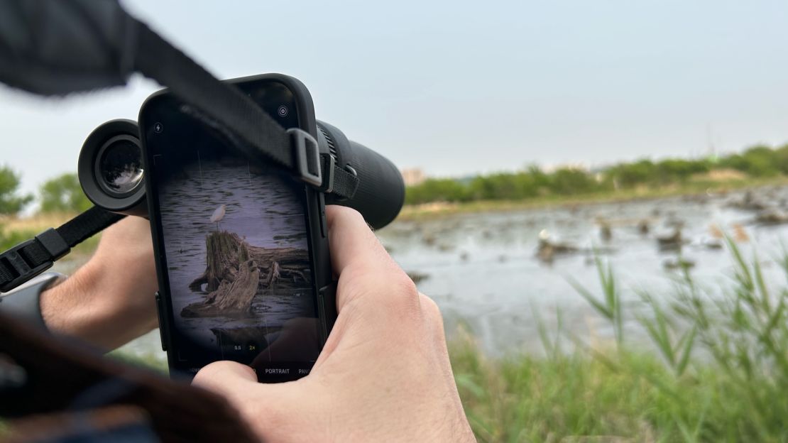 Hold your phone up to your binoculars to snap a picture or record a video. That's called digibinning.