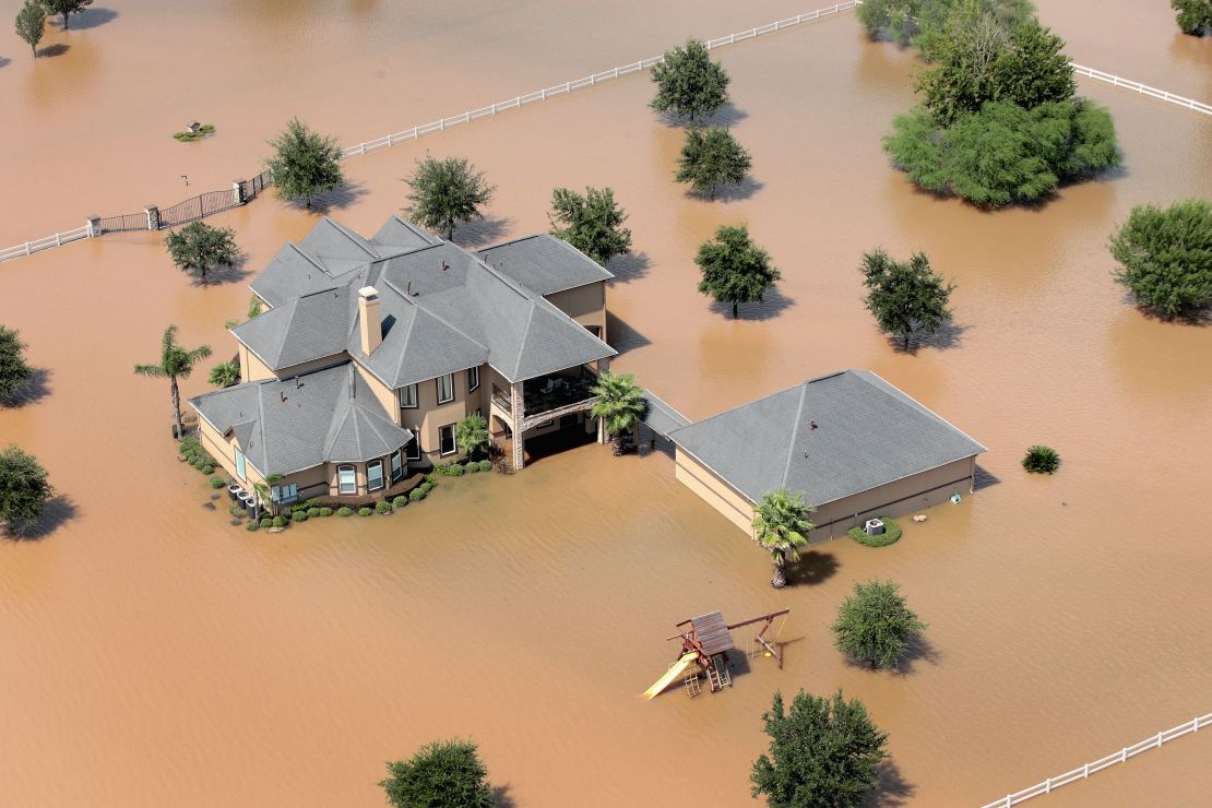 A home is surrounded by floodwater after torrential rains brought by Hurricane Harvey pounded the region on August 31, 2017, near Sugar Land, Texas.