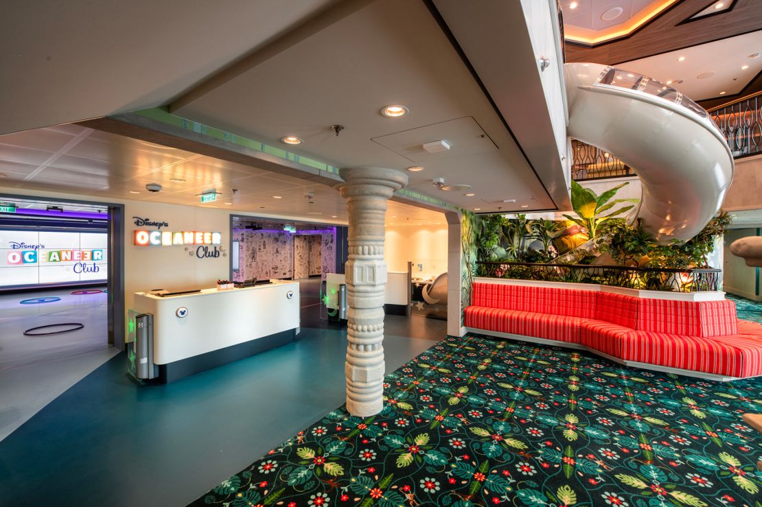 A slide delivers kids to the Oceaneer Club aboard the Disney Treasure.