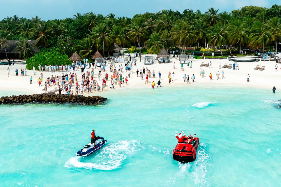 Santa arrives on the beach at the One&Only Reethi Rah in the Maldives.