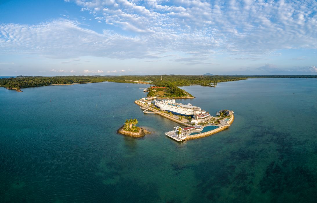 The Doulos Phos The Ship Hotel occupies an artificial anchor-shaped spit of land reclaimed specifically for the venture.
