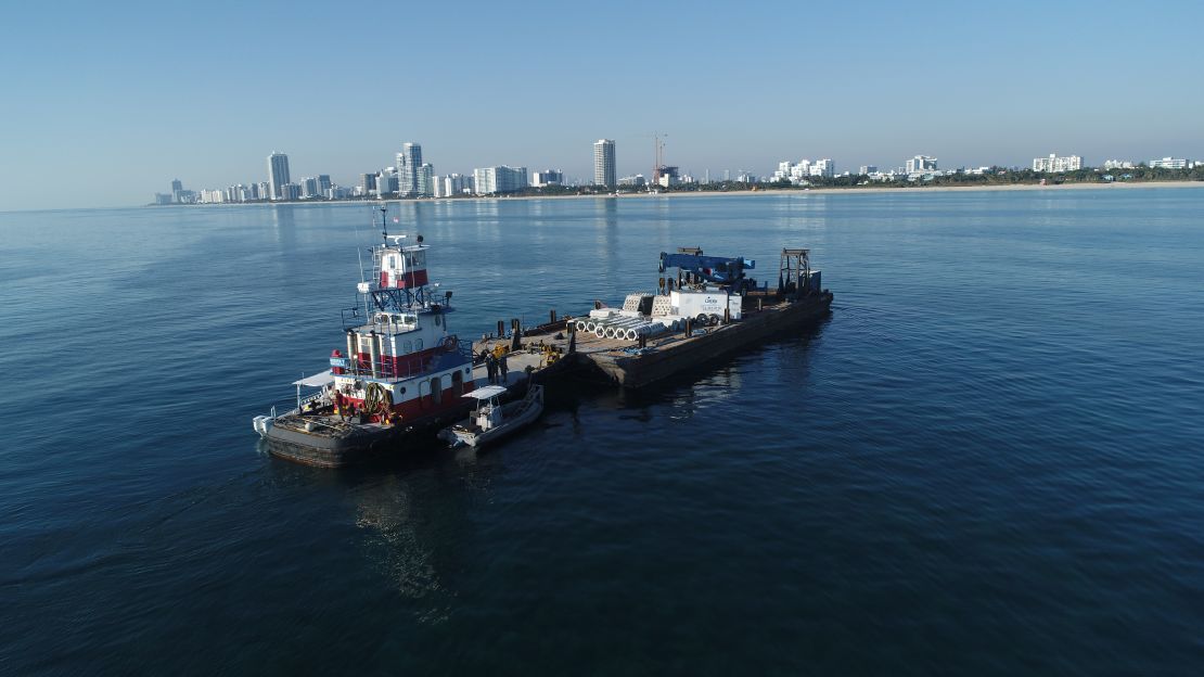 The ECoREEF project, pictured here on a barge before placement, is a two-year experiment to test if hybrid reef structures could enhance coastal resiliency and coral survival.
