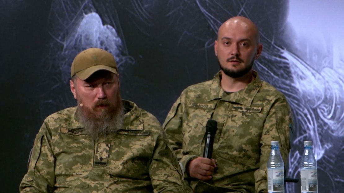 Robert “Magyar” Brovdi, left, speaks on a panel at the Association of the US Army’s meeting in Wiesbaden, Germany, on Wednesday, July 16, 2025.