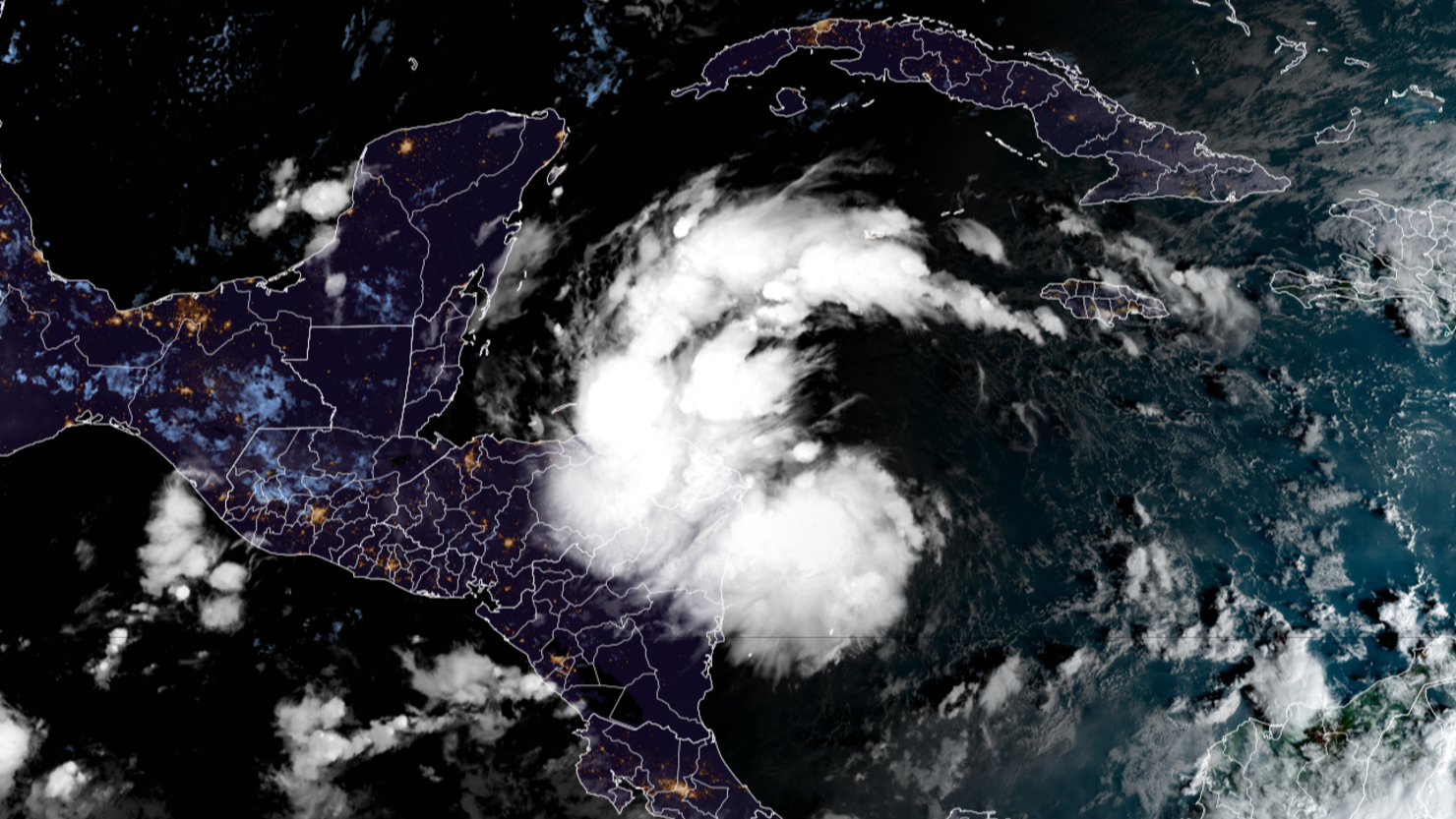 Tropical Depression Nineteen churns in the Caribbean Sea early Thursday morning.