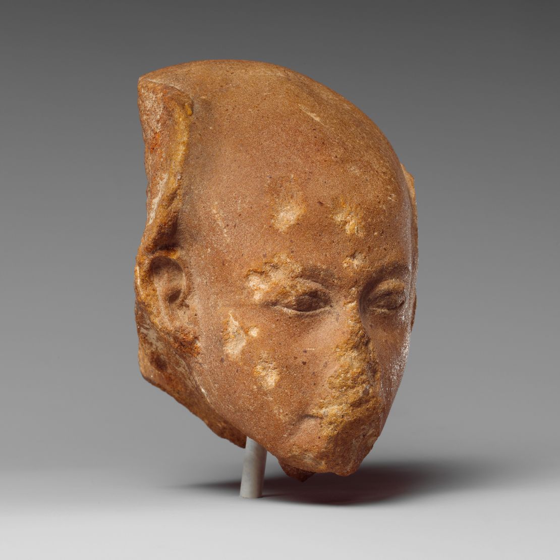 The head of an Ancient Egyptian princess from a group statue dating from the Amarna Period circa. 1352 to 1336 B.C.