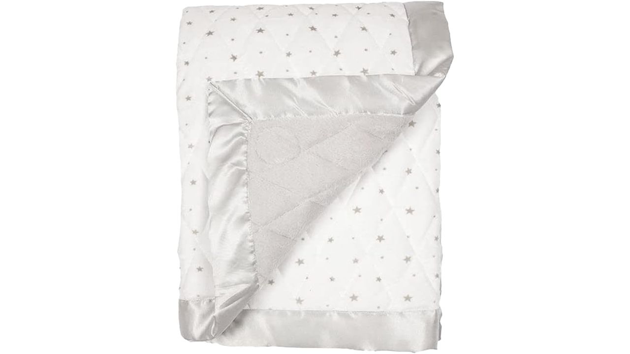 A photo of a white Dreamland 4-Pound Weighted Sleep Blanket